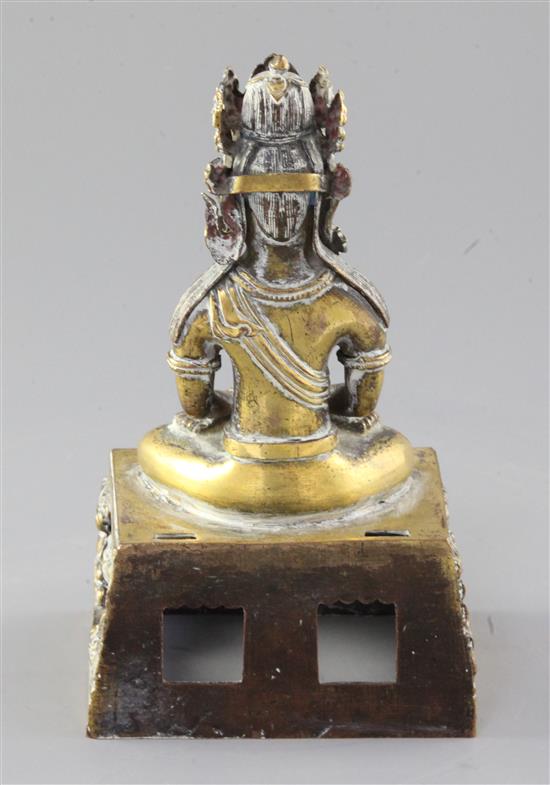 A Chinese gilt bronze figure of Amitayus, Qianlong mark and period, dated 1770, height 19cm, lacking aureole